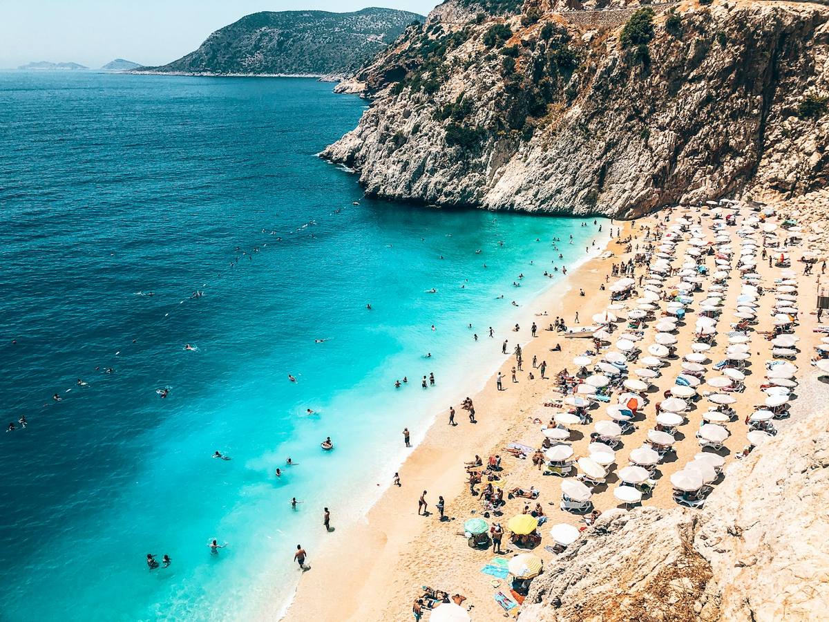 Turquoise water and sun loungers on an Antalya beach