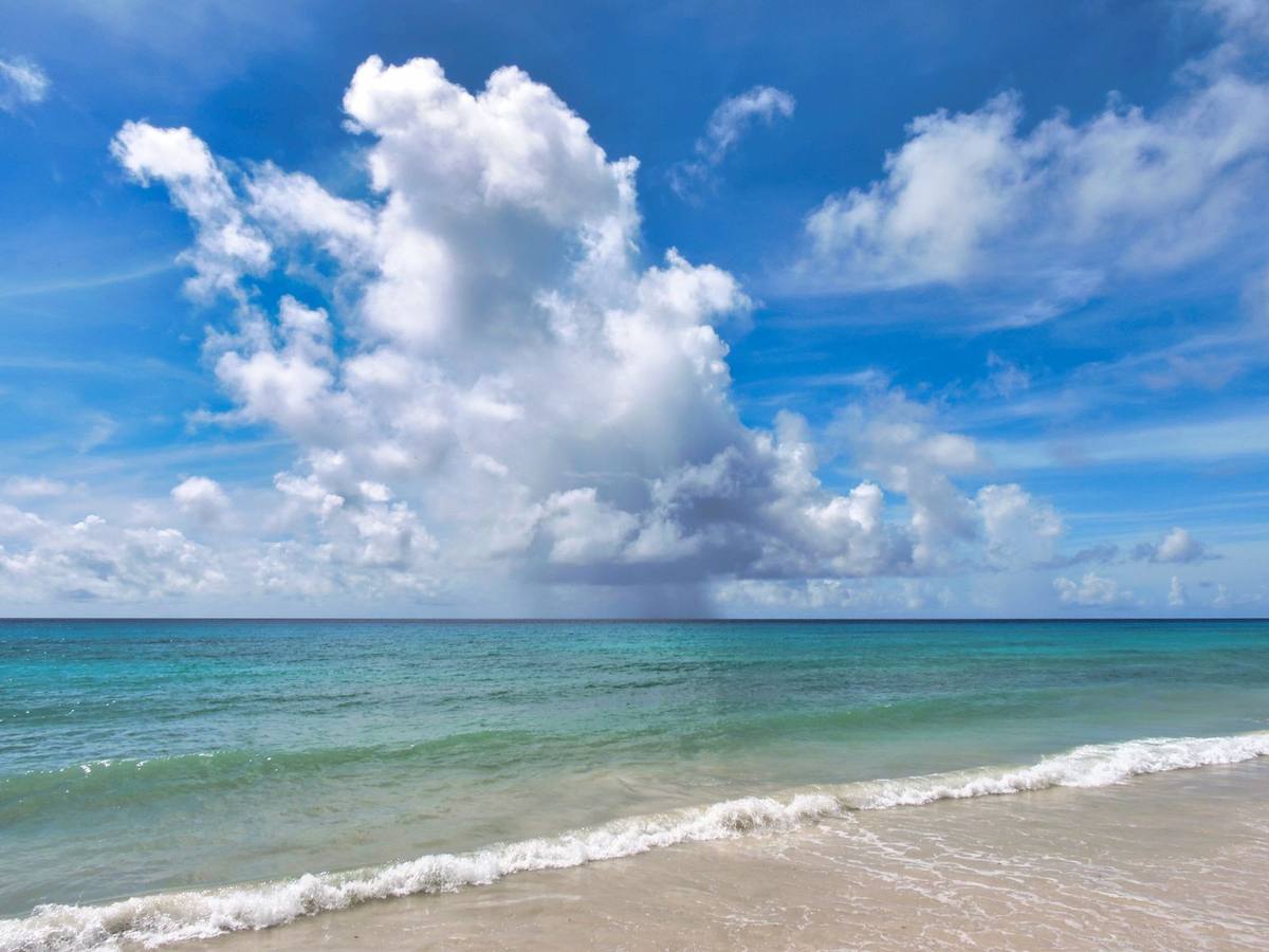 A quiet beach under dramatic clouds in Barbados