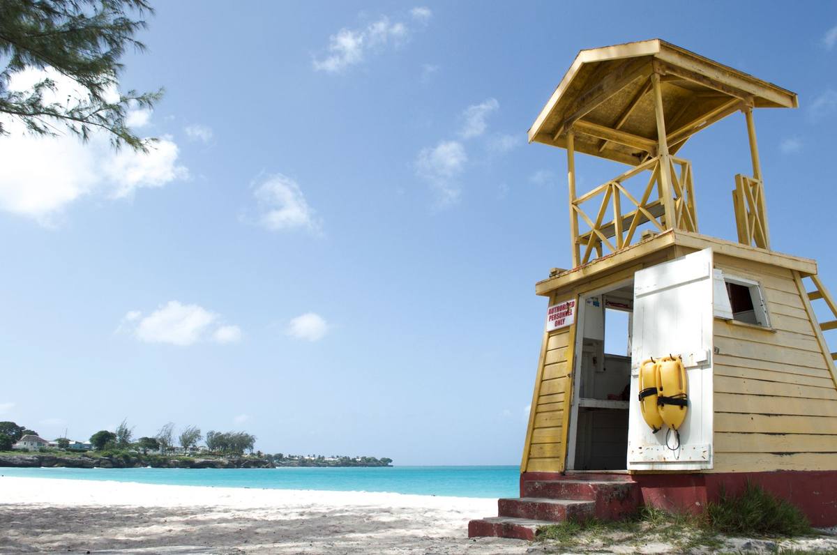 A wooden lifeguard tower on a Barbados beach