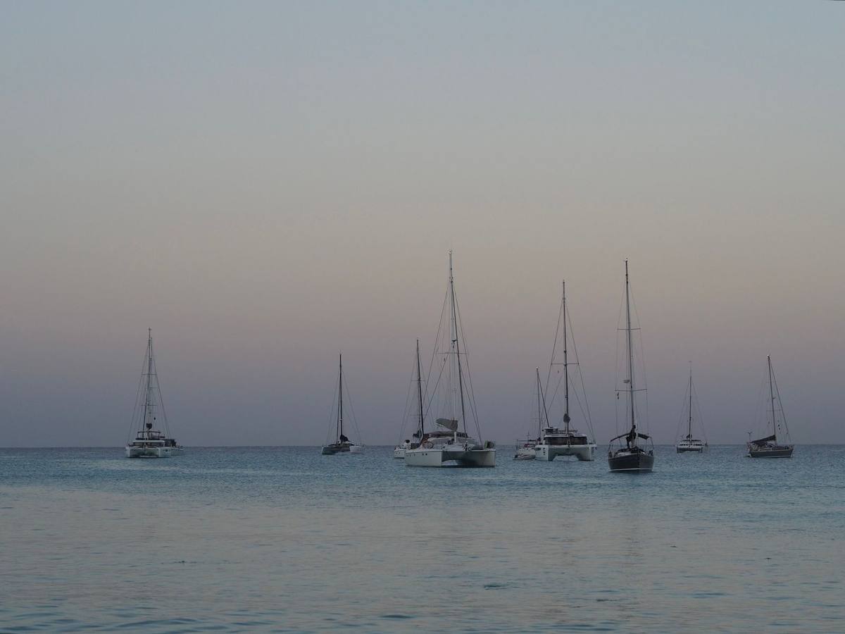 Sailing boats anchored at sunset off Holetown, Barbados