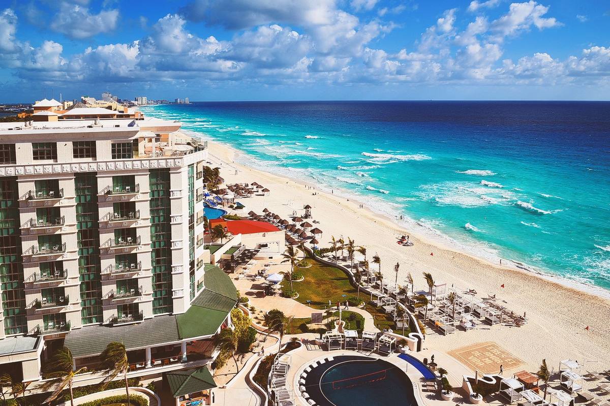 A beachfront resort and coastline in Cancún from the air