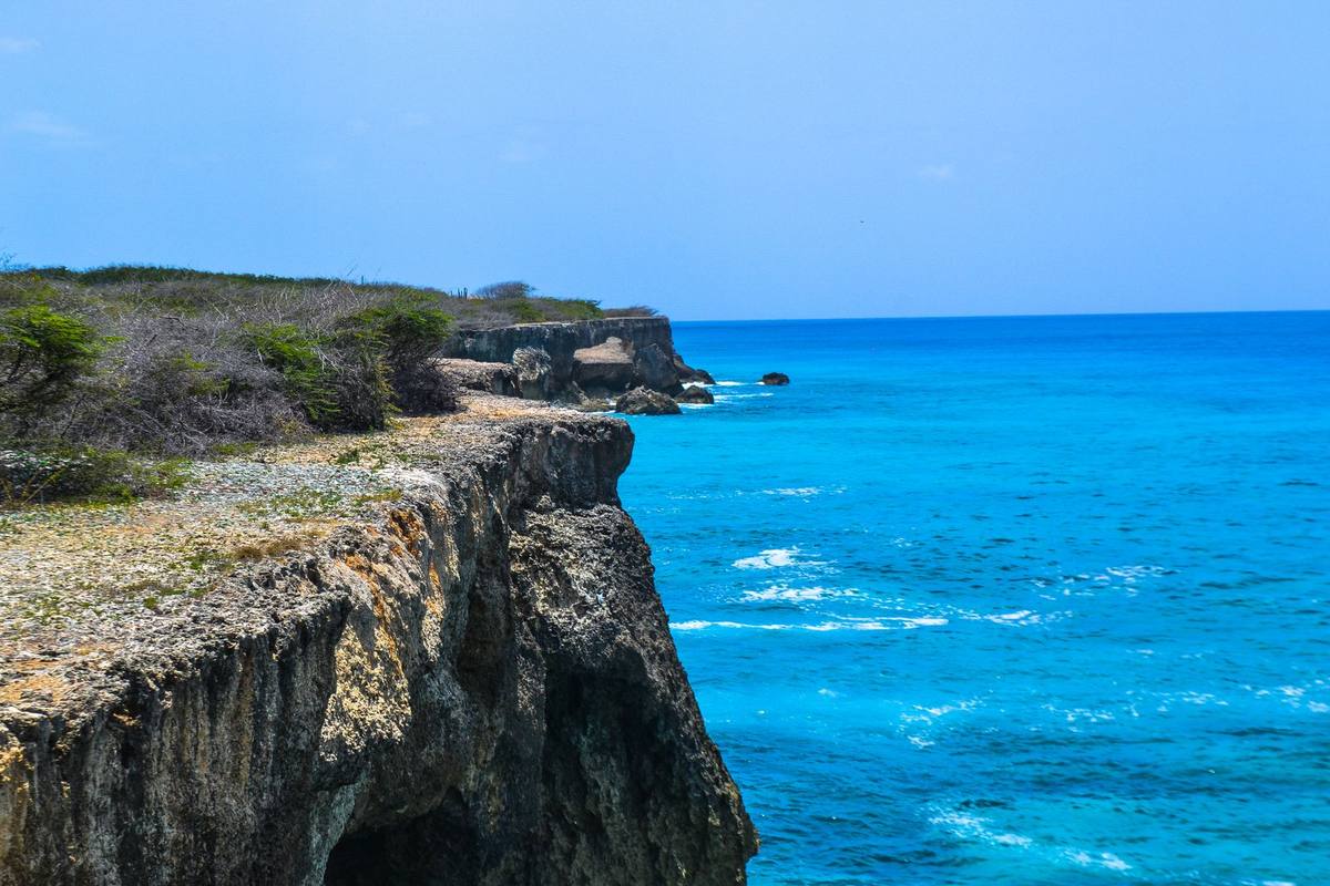 Cliffs and vivid blue water on the Curaçao coast