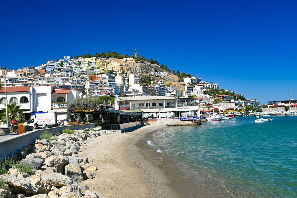 Kusadasi town beach backed by hotels and restaurants