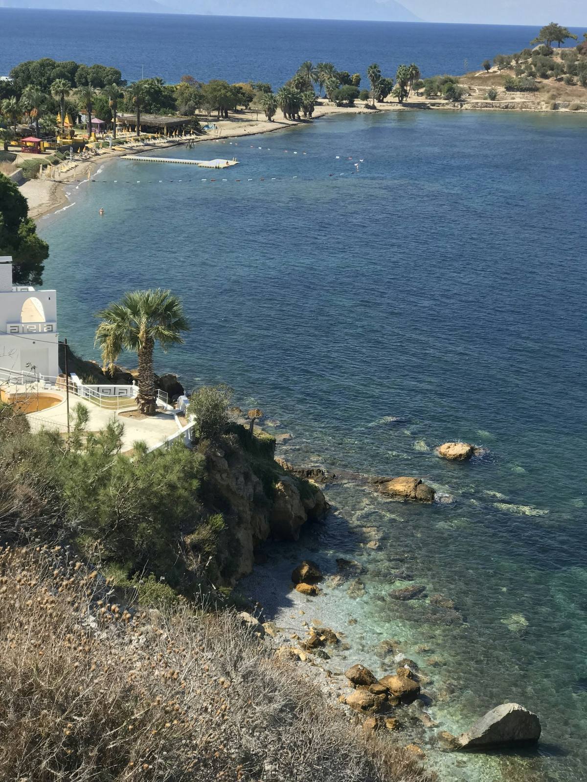 Kusadasi beach and turquoise bay seen from the hillside