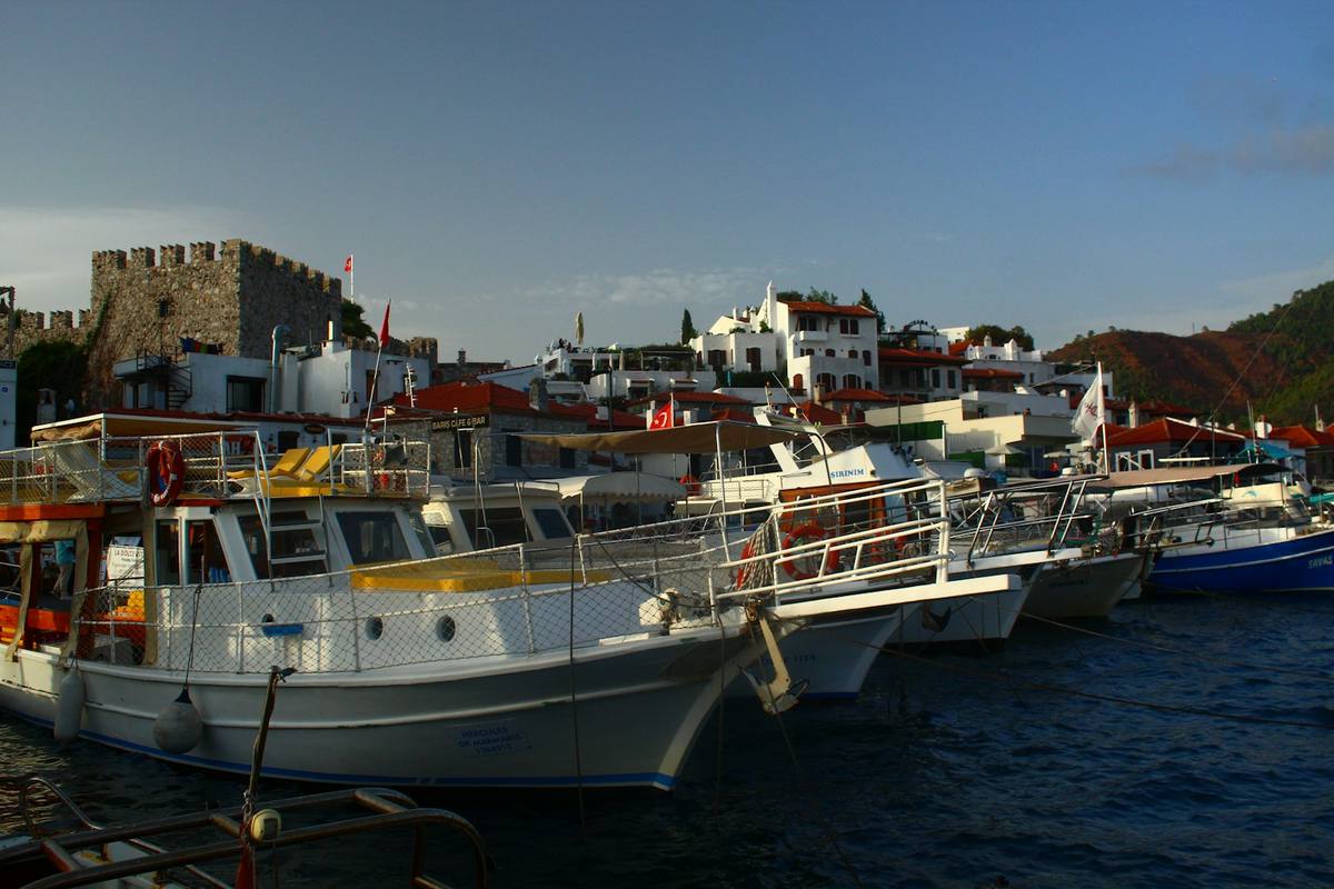 Boats moored below Marmaris Castle in the old harbour