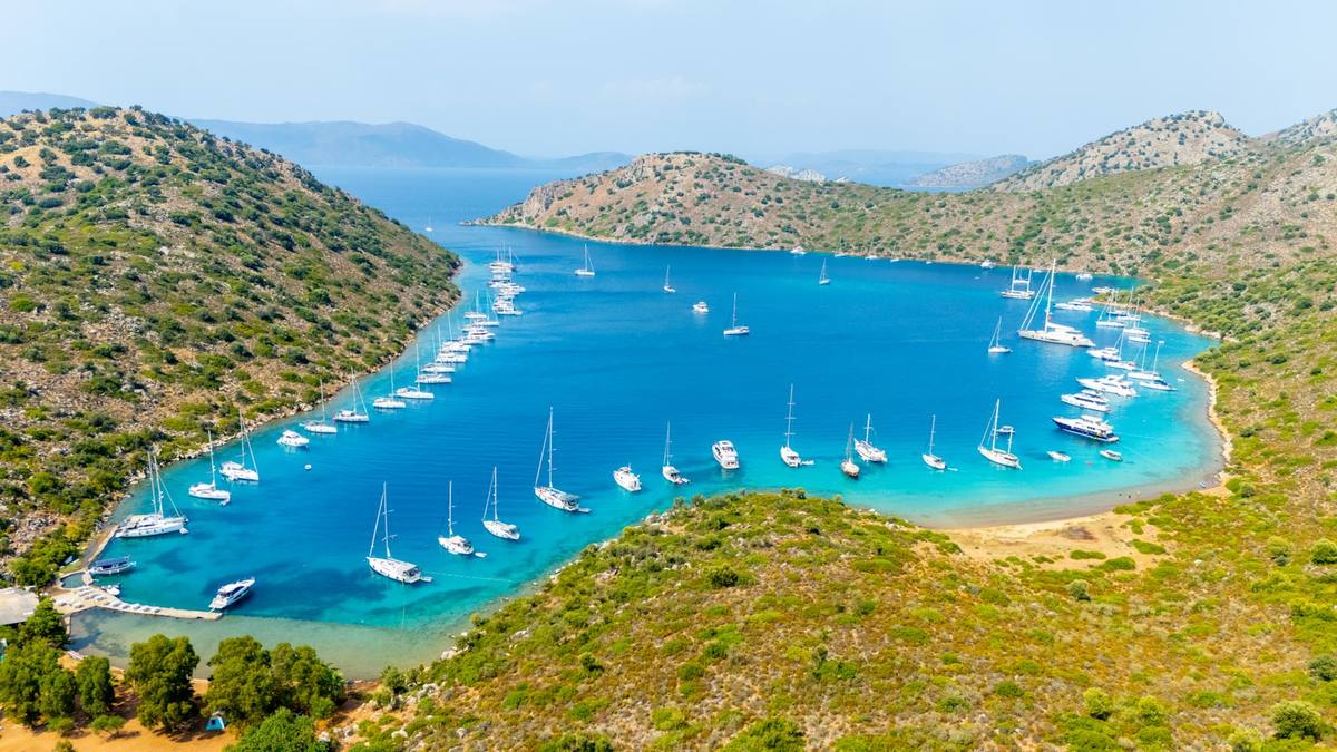 Sailboats anchored in a clear blue bay near Marmaris